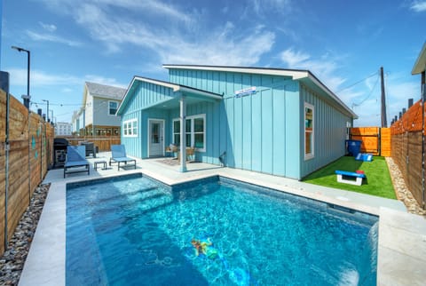 Your private pool is perfect for sunny Port Aransas days, with lounge seating and space to unwind right outside the house.