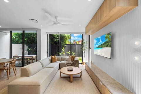 Japandi-inspired living room with Smart TV, ducted AC and natural light.