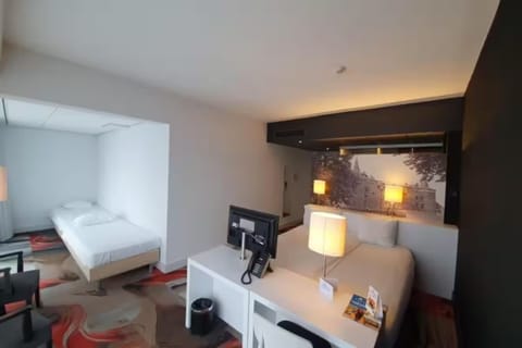 Settle into a spacious suite with warm lighting and calm vibes.