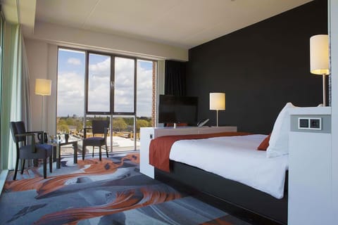 Wake up to sunlit views from your plush bed.