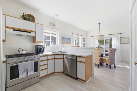 Kitchen area with new stainless steel appliances