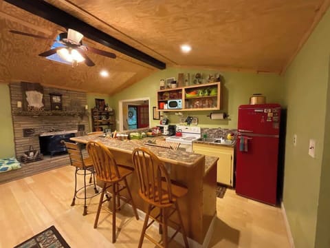 Retro-inspired kitchen w/ red fridge & vintage flair