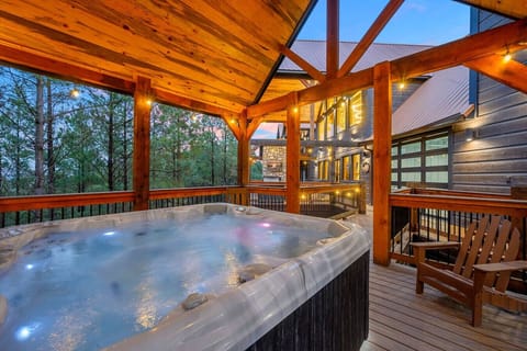 Soak under the stars in this private hot tub while taking in views of the wooded mountain landscape.
