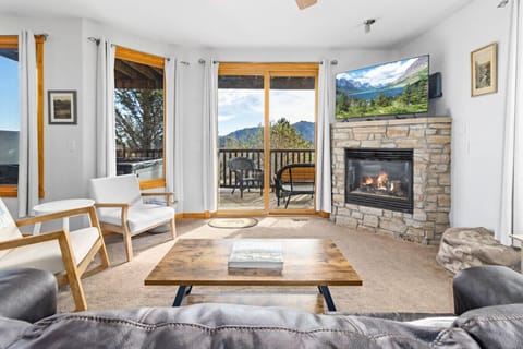 Unwind in the living room with fireplace and natural light