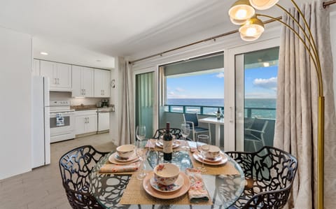 Dining for 4 guests located off of balcony and kitchen