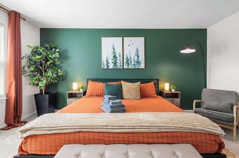 [Bedroom #2 Upstairs] Live life king-size with an en-suite bathroom and a wall-mounted Smart 4K TV