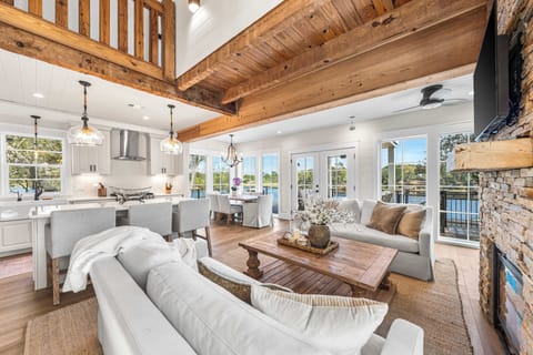 Enjoy the seamless flow between the airy living space, modern kitchen, and sun-drenched dining area