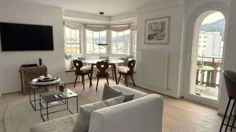 Living and dining room with a comfortable sofa