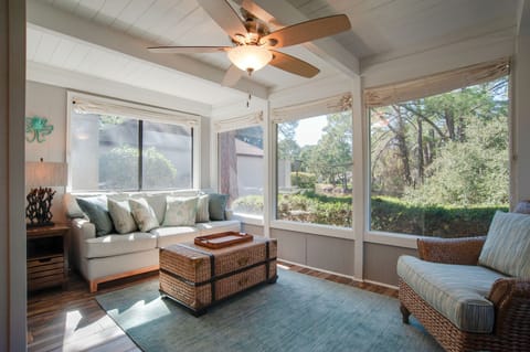 This Carolina room offers beautiful natural light and a relaxing area. 