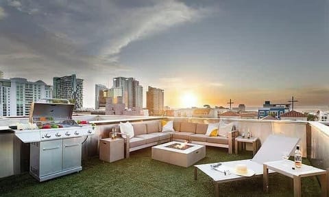 Rooftop terrace with skyline views and cozy lounge seating