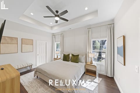 Spa-inspired ensuite with double vanity and walk-in glass shower for a refreshing start or relaxing end to your day.