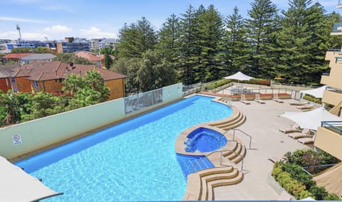 Resort-style pool with ocean views
