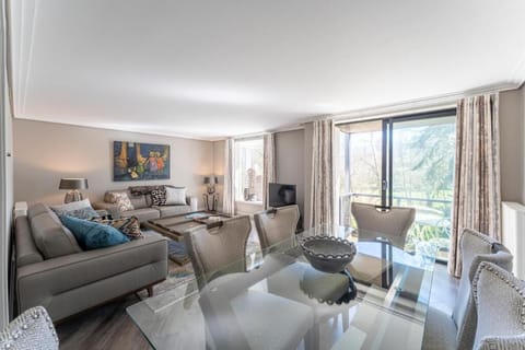 Unwind in sunlit open-plan lounge with calming balcony views.