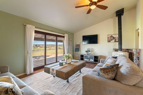 Living room centered on the wood stove and TV