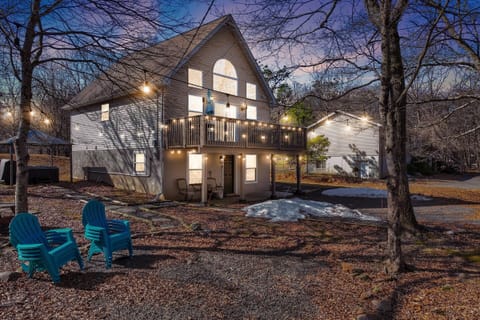 Charming front yard at night, beautifully lit for a warm welcome.
