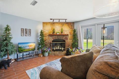 Relax by the stone fireplace with panoramic views of the lush Gatlinburg landscape!