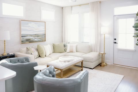 Designed for gathering and entertaining, the comfortable living room provides the perfect setting for movie nights and quality time together.