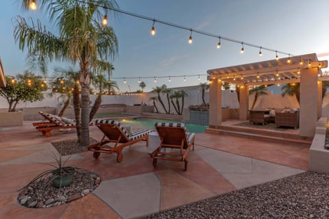 Welcome to CALMING CACTUS, our 4 BR, 2 BA, one story home with a private pool, waterfall, fire pit and putting green.