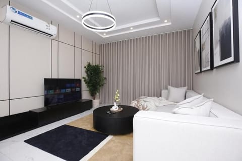 Deluxe Apartment, 3 Bedrooms, Non Smoking | Living area | Flat-screen TV