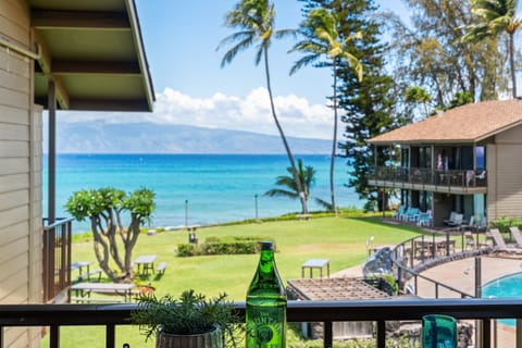 Take in sweeping ocean views, manicured lawns, and tropical palm trees right from your private covered balcony.