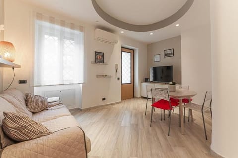 Apartment, Garden View | Living area | Flat-screen TV
