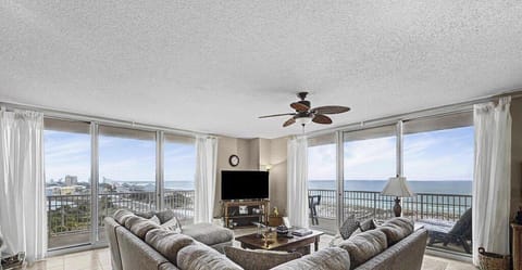 Bright, airy living room with generous space to unwind and seamless balcony access for effortless indoor-outdoor living