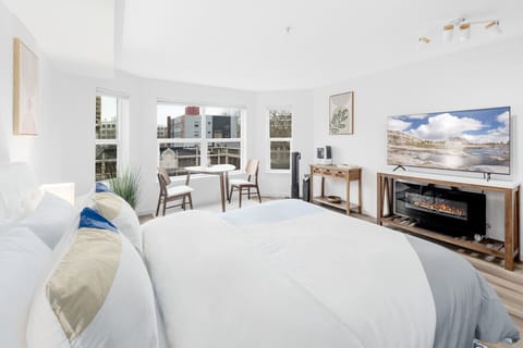Fall asleep to the cozy glow of the fireplace after a long day exploring the Seattle streets.
