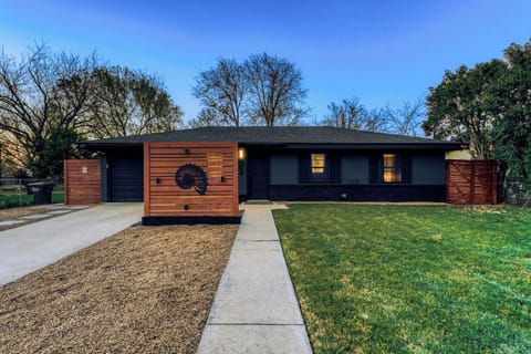 Modern Georgetown home with bold curb appeal, spacious front yard, and private driveway parking