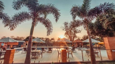 Indoor pool, outdoor pool, open 10:00 AM to 10:00 PM, pool umbrellas