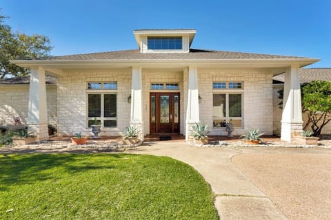 Beautiful front entrance of this private ranch-style home in Lago Vista, offering a peaceful and welcoming arrival experience