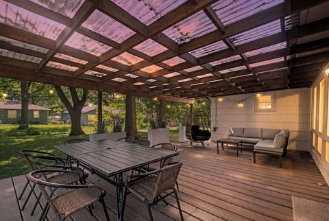 Spacious backyard deck with shaded seating and room to relax. Ideal for entertaining or unwinding after exploring Kansas City.