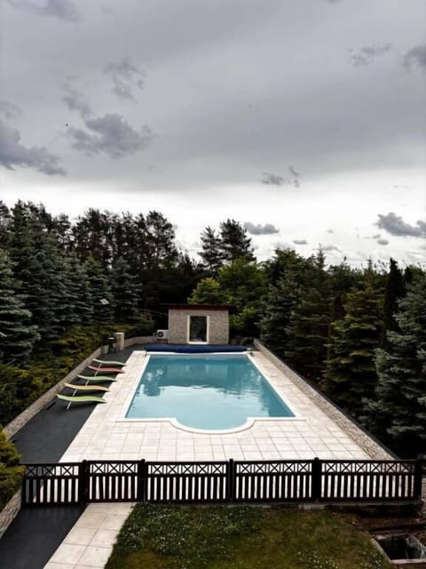 Seasonal outdoor pool, open 9:00 AM to 8:00 PM, pool umbrellas