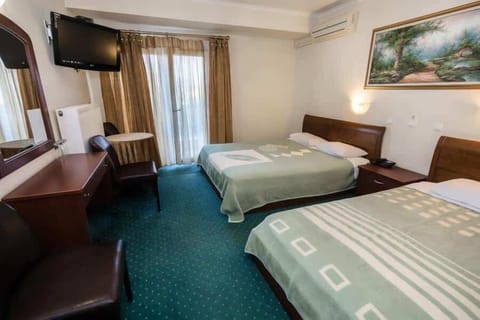 Classic double room with a double/double plus single bed