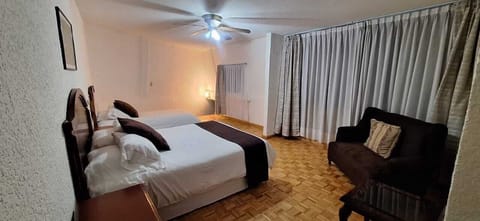 Family Apartment, 2 Bedrooms, City View | In-room safe, desk, laptop workspace, blackout drapes