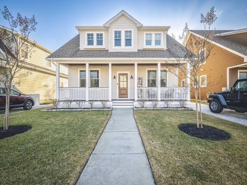 Stroll up to this charming cottage, where a welcoming porch invites relaxation and gatherings.