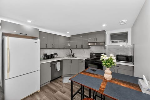Modern fully equipped kitchen with new appliances and dining area