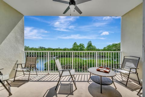 Spacious waterfront balcony with outdoor lounge seating