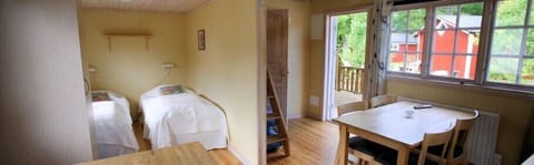 Cottage, 2 bedrooms (sheets/cleaning not included) | Living area | 32-inch TV with satellite channels