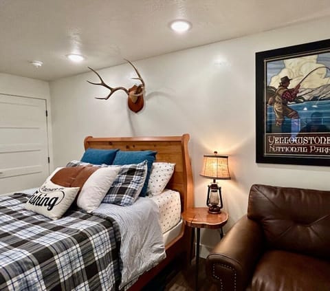 Queen Bed with adventurous cabin decor. 