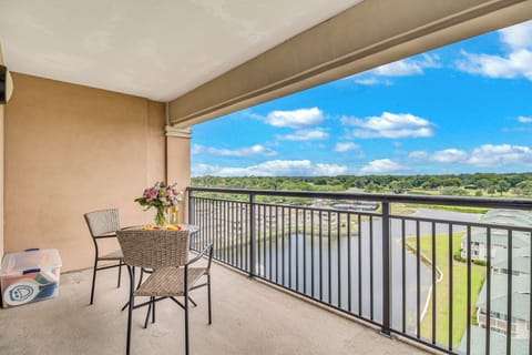 Enjoy your morning coffee on your private balcony, overlooking lush green landscapes that stretch to the horizon.