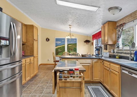 Fully Equipped Kitchen: refrigerator with ice maker, oven/range, microwave, toaster oven, toaster, dishwasher, and drip coffee maker — everything you need for home-cooked meals.

