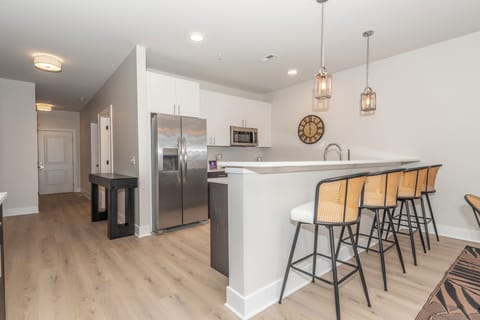 Bright, open kitchen with island seating for 4, perfect for gathering