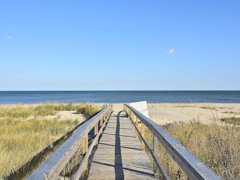 Feel the ocean breeze as you step onto the boardwalk, ready to dig your toes into the warm sand.