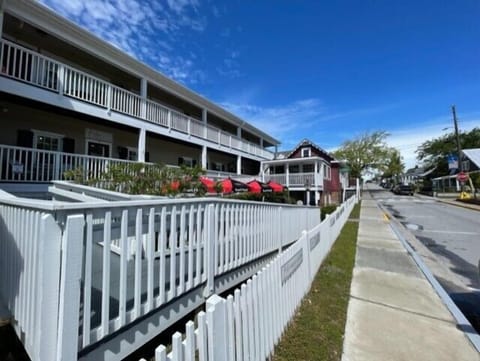 Step into a charming waterfront community where traditional architecture meets coastal charm along quiet neighborhood streets.