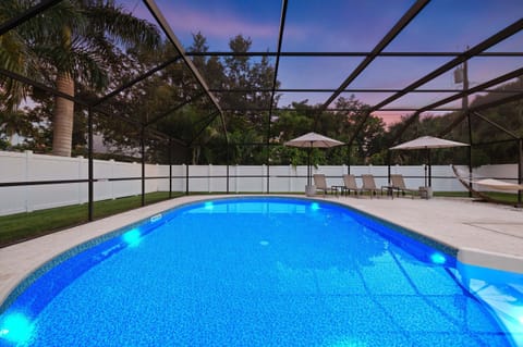 ☀️ Relax in your private screened-in heated pool, surrounded by lush tropical landscaping and plenty of space to soak up the Florida sunshine.