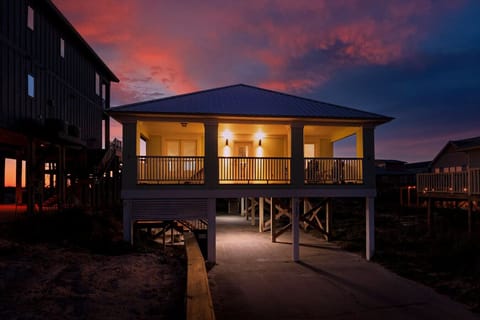 Watch the sky light up in every color imaginable from your private beachfront perch at this stunning elevated home.