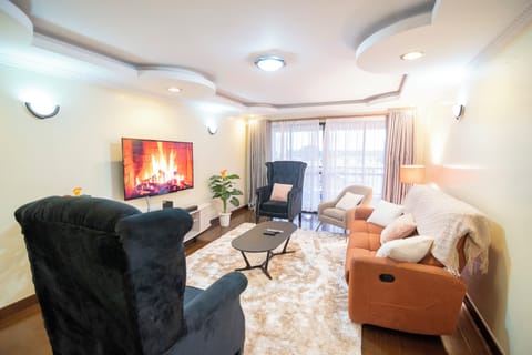 Family Apartment, City View | Living area | Smart TV