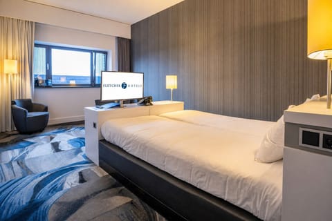 Unwind in a cozy, modern room with soft lighting.
