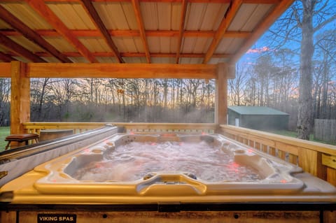 Soak away your stress in this private hot tub with forest views, where warm bubbles and nature's tranquility create your perfect evening retreat.