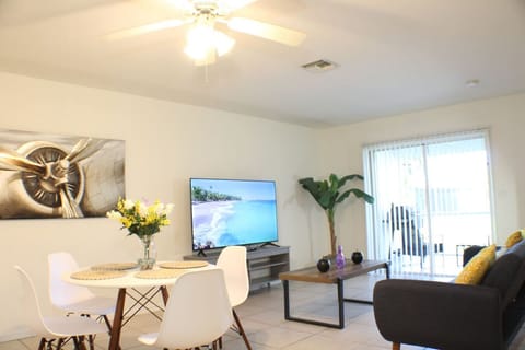 The kitchen integrates the dining and living room area